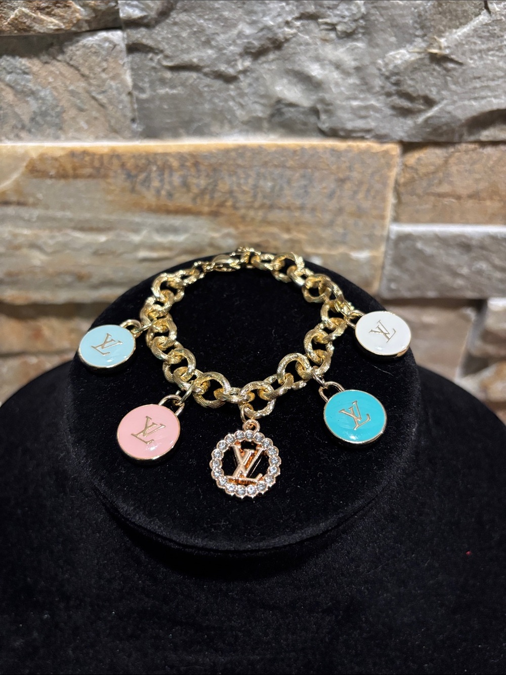 Gorgeous Gold Plated Charm Bracelet with Pink, Turquoise, White & Blue LV Discs